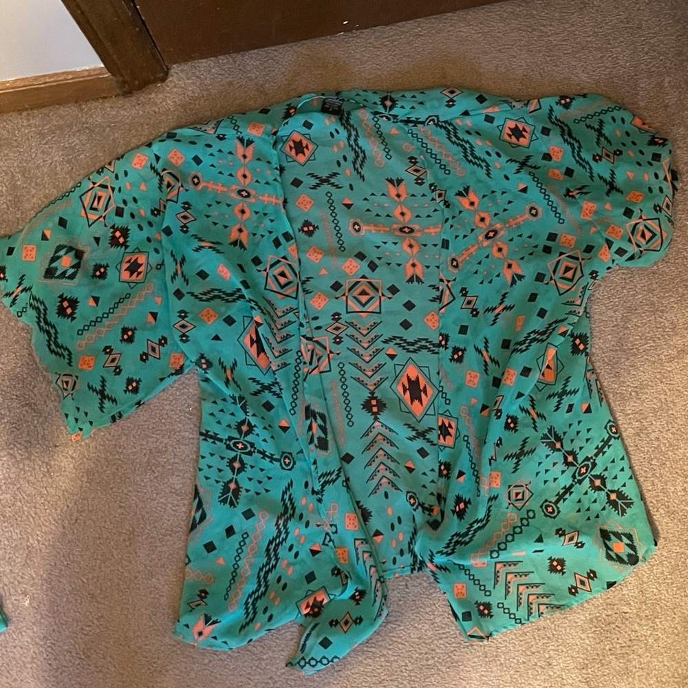 green shaw with geometric design